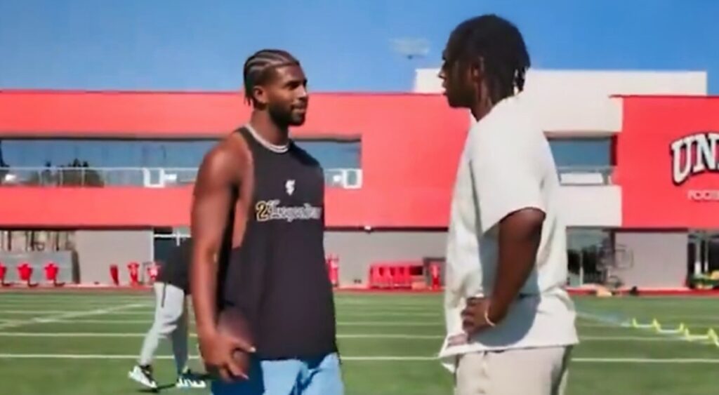 Shedeur Sanders and Cam Ward talking at practice.