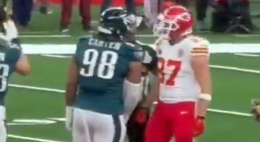 Travis Kelce and Jalen Carter exchanging words.