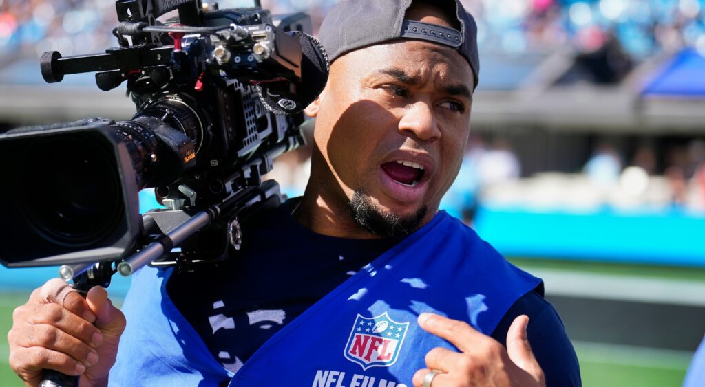 Steve Smith Sr. holding a camera